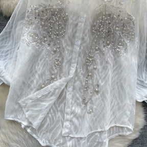 Camisa com Gola Alta, Bordados e Paetês – Elegância com Toque Brilhante