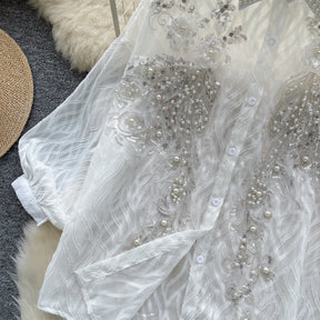 Camisa com Gola Alta, Bordados e Paetês – Elegância com Toque Brilhante