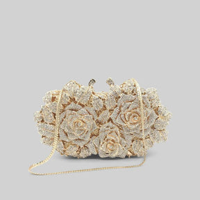 Bolsa clutch com enfeite de cristal